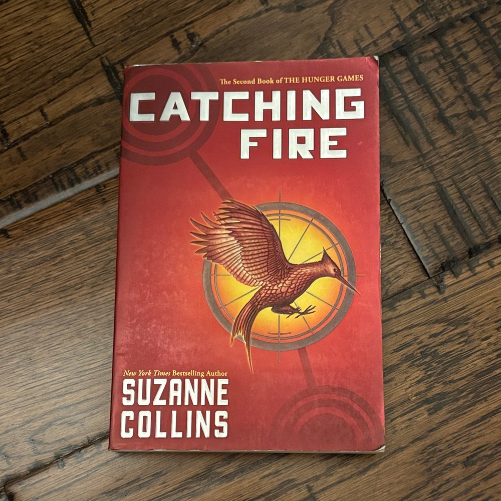 Catching Fire (Hunger Games) Scholastic Red and Gold Paperback Back Cover